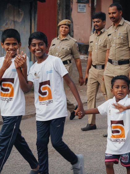 Young walkers with the local police, who walked alongside them to provide encouragement and security.