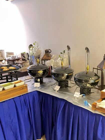 A view of the buffet station with black serving dishes and elegant lanterns. This shows how I can create a setup that is both fun for kids and stylish for adults.