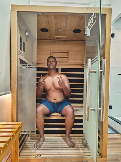 A happy client enjoying the gentle, therapeutic heat in our infrared sauna. The sessions are designed to help with weight loss, reduce inflammation, and provide a deep detoxification.