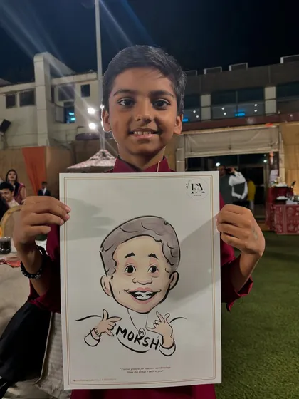 This young man is all smiles with his caricature, which captures his playful personality. A great return gift idea for birthday parties.