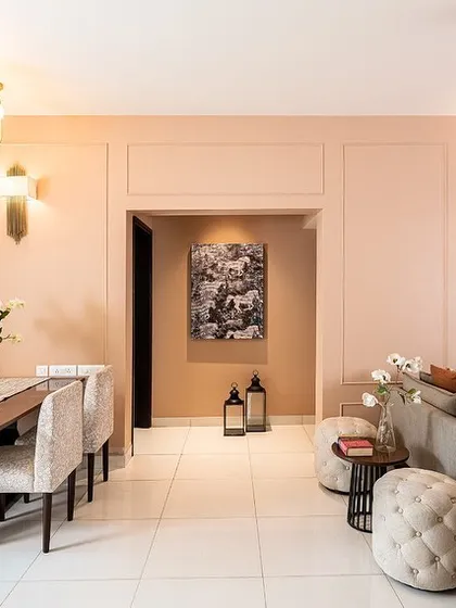 Galloping horses symbolize freedom and liberation. This monochrome painting, placed in a dining area, brings a sense of movement and majestic energy to the home.