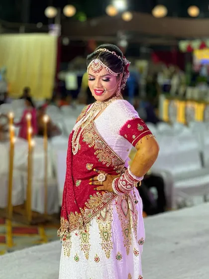 Another full-length pose, highlighting the elegance and grace of the bride in her complete ensemble.