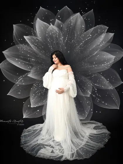 Motherhood in full bloom. This is one of my signature artistic portraits, where I use creative lighting and props to transform a simple photo into a piece of dreamy, magical art.