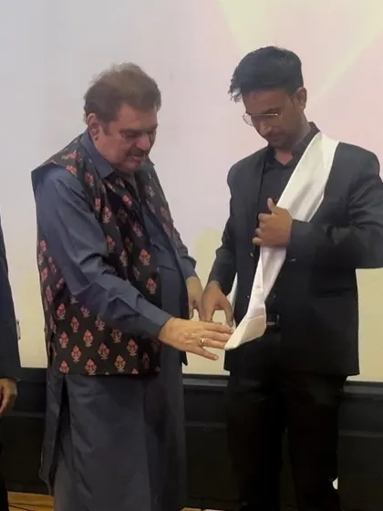 Raza Murad ji presenting me with the sash for the "Rising Award of the Year." 