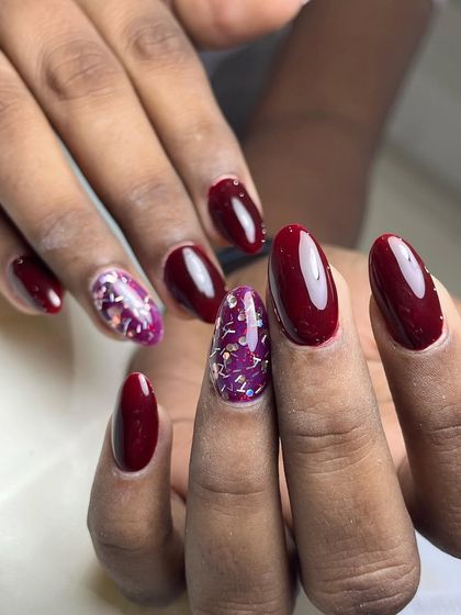 A final look at this classic red manicure. The color is rich and opaque, and the glitter accent nail provides a fun contrast.