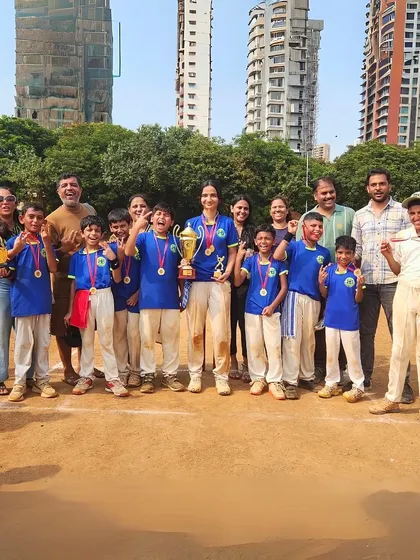 The joy of victory is a shared experience. Here, our young champions, both boys and girls, celebrate their hard-earned success together, lifting a trophy that symbolizes their teamwork and dedication.