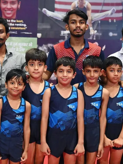 The boys' team poses with their coaches. We are proud of the camaraderie and team spirit at our academy.