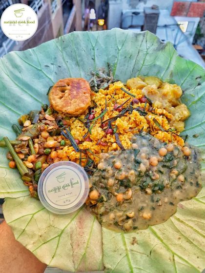 Holding up a serving of our NCF khechri, ready for the Kang (Ratha Yatra) festival. It's a taste of home, right here in the national capital.