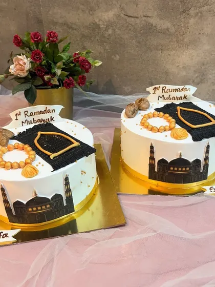 I love creating special cakes to celebrate a child's first Ramadan. These custom eggless cakes feature edible prayer mats, tasbeeh beads, and a mosque silhouette to make the occasion memorable.