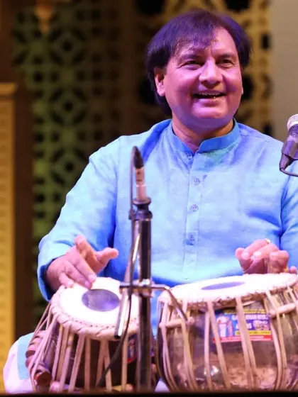 A smile during a performance is a sign that the audience and the artist are connected as one. This was captured during a tabla duet, a moment of pure happiness in the flow of rhythm.