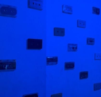 My wall of inspiration, featuring classic cassette tapes. I draw from all eras of music to bring a fresh perspective to my modern electronic productions.