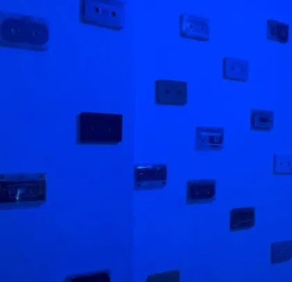 My wall of inspiration, featuring classic cassette tapes. I draw from all eras of music to bring a fresh perspective to my modern electronic productions.