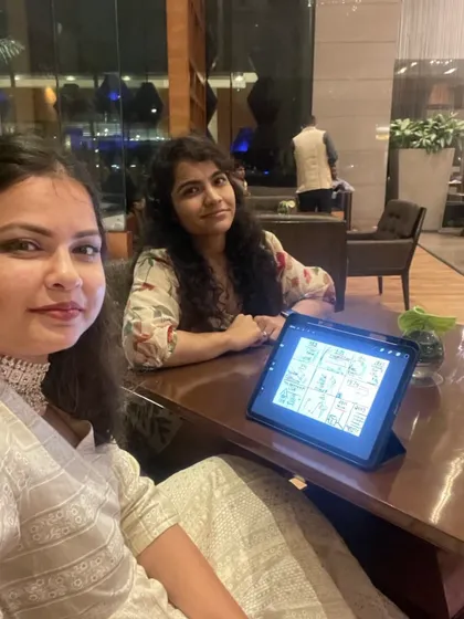 Work mode with my team. We are discussing the storyboard and flow on an iPad before a live show to ensure every detail is perfect.