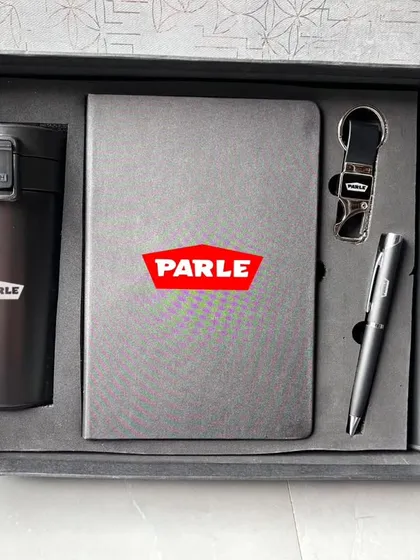 For a premium look, I offer sets like this one for Parle. It features a temperature flask, a travel mug, a diary, a keychain, and a pen, all in a coordinated dark grey, presented in a high-quality gift box.