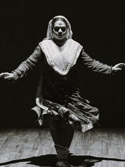 A powerful moment captured in black and white during the Abhiratna Awards. The dramatic lighting highlights the form and posture that are so integral to the Kathak dance style.