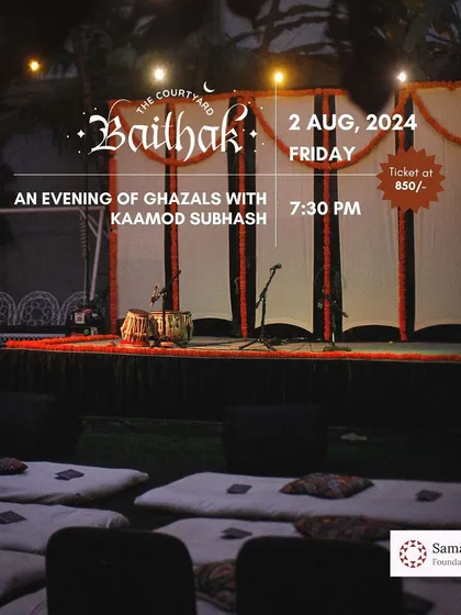 The stage is set for an evening of ghazals with Kaamod Subhash. The floor seating and simple, elegant decor create the perfect ambiance for an intimate musical soirée.