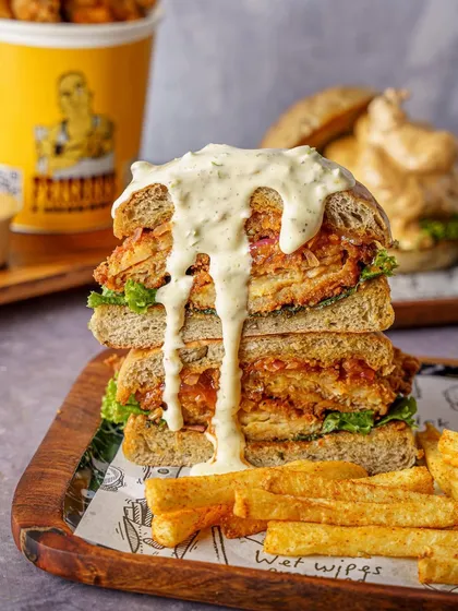 This is how you shoot a burger. It’s not just about stacking ingredients; it’s about capturing that messy, drippy, can’t wait to eat it feeling. This kind of food photography is perfect for delivery apps and social campaigns that need to make an impact.