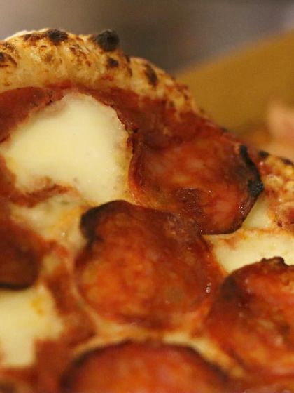 A single slice of my mini pepperoni pizza. Even in a smaller size, it packs all the flavor of a full-sized pie with its cheesy base and savory pepperoni.