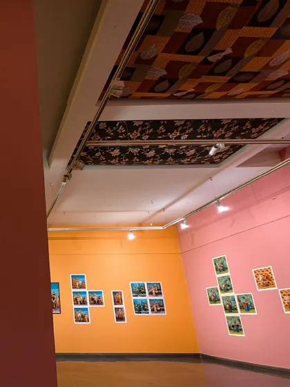Another installation view of 'No Longer A Memory', capturing the relationship between the different colored walls and the arrangement of the photographs.