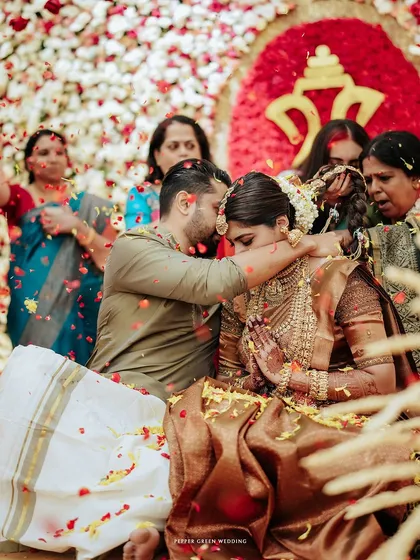 A moment of blessing as the couple is showered with flower petals by their loved ones.