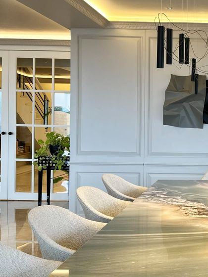 A view from the side, showing the sculpture in the context of the home's architecture.