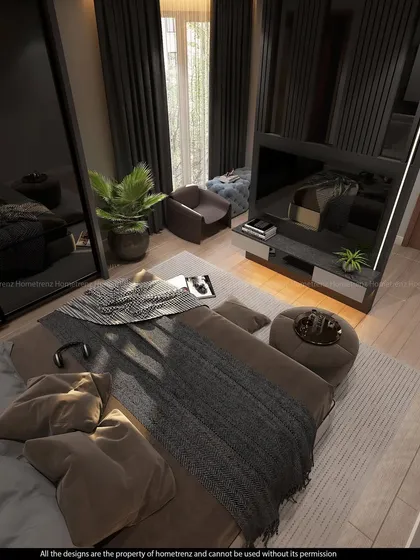 An overhead view of a master bedroom, showing the layout with a TV partition, a small seating area, and a large bed. The dark, moody tones create a cozy and intimate atmosphere.