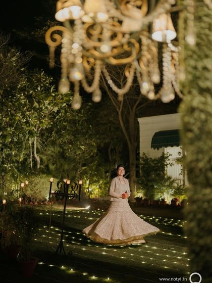 A magical shot of my bride twirling. Her makeup is set to be picture-perfect from every angle, capturing the joy of the moment.