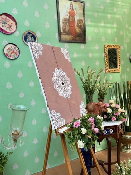 The beautiful name reveal easel, decorated with fresh flowers, waiting for the special moment.