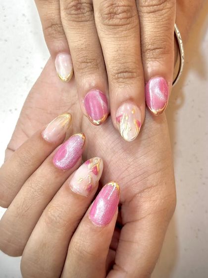Another view of the pink and gold abstract art, showing how it looks on beautifully shaped oval nails.