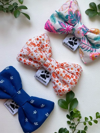 Another beautiful selection of my handmade bows, featuring a royal blue, a delicate floral, and a tropical leaf print. Perfect for any occasion.