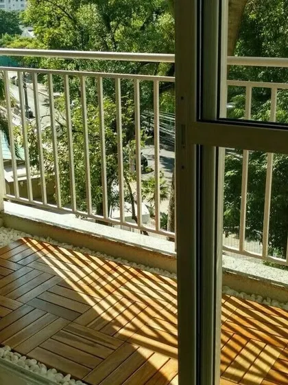 Even on a bright, sunny day, these wooden deck tiles provide a clean and sophisticated look. They are a great way to cover old concrete or tile floors for an instant upgrade.