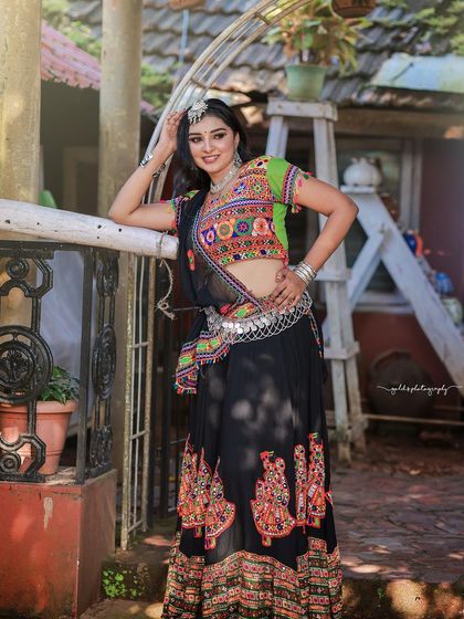 A vibrant and energetic series celebrating Navratri. The model is dressed in colorful Garba attire, and the photos capture the festive spirit through dynamic poses and joyful expressions.