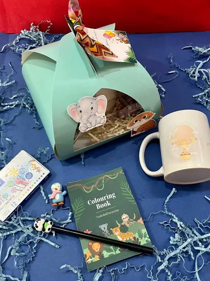 Our jungle-themed return favour set is perfect for younger kids. It includes a customised mug, an animal-themed pen, a colouring pad with crayons, a small eraser, and some candies.