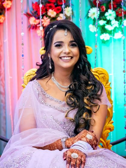 A bright and happy portrait of the bride-to-be, her smile lighting up the frame.