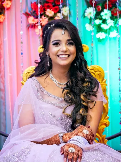 A bright and happy portrait of the bride-to-be, her smile lighting up the frame.