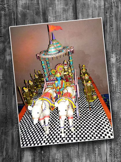 An incredibly detailed 3D paper quilling sculpture of Krishna and Arjuna on their chariot from the Mahabharata. This shows the advanced possibilities of quilling.