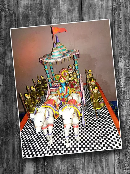 A magnificent 3D paper quilling masterpiece by Neha Kumari, depicting the chariot of Krishna and Arjuna from the Mahabharata. The entire scene, including the horses and soldiers, is crafted from rolled paper, showcasing phenomenal skill and dedication.