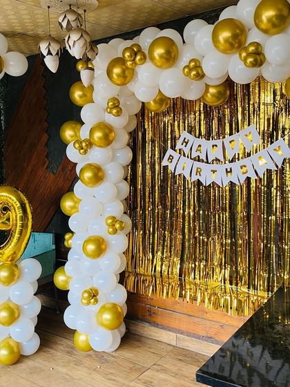 A full view of the white and gold 19th birthday setup.