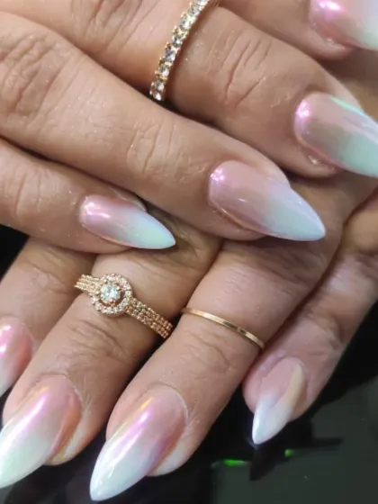 A stunning iridescent ombre, shifting from a pearly pink base to a frosty white tip with a beautiful sheen.
