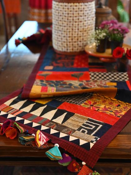 A close-up of the scrap throw's tassels and the intricate patchwork. These one-of-a-kind pieces are time-consuming but are a true expression of my love for the process.