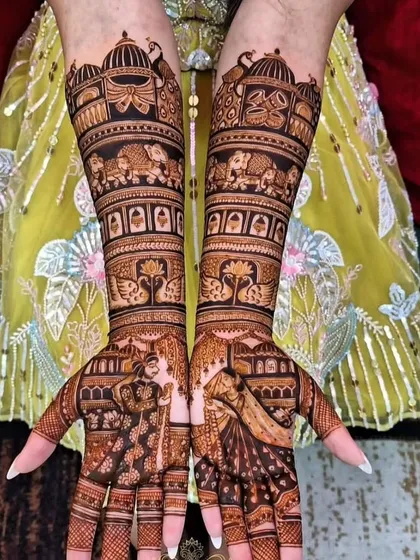 This grand bridal design features a bride and groom on the palms, with bands of elephants and palace architecture extending up the arms, creating a truly royal look.