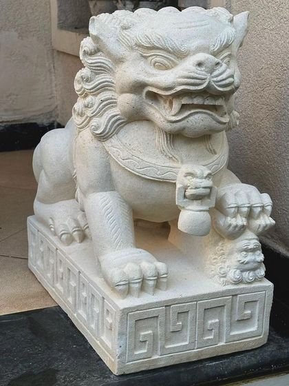 This is our majestic sandstone Foo Lion, a traditional guardian figure. Its presence is meant to protect the home, making it a meaningful and powerful addition to any entrance.