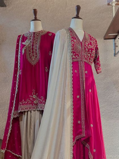 The timeless elegance of Jayanti Reddy's designs. This fuchsia pink kurta with intricate silver embroidery is paired with a lighter-toned sharara, creating a graceful, festive look.