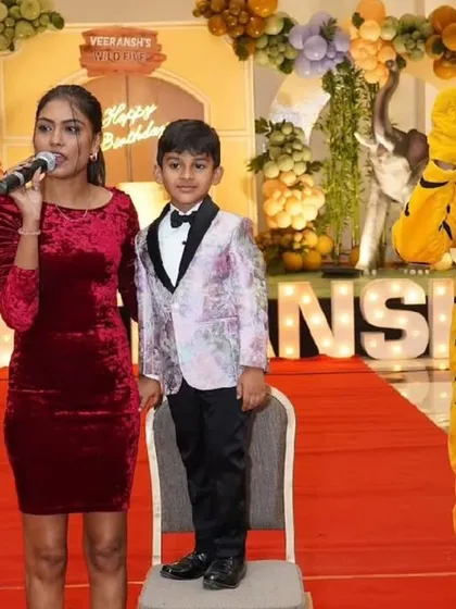 A tiger mascot makes a grand entrance on the red carpet alongside the birthday boy at his "Wild One" jungle-themed party. Our mascots add a theatrical element to any celebration.