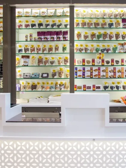 This is the main billing counter area. It's designed to be clean and efficient, with our products displayed clearly in the background so you can grab any last-minute items.