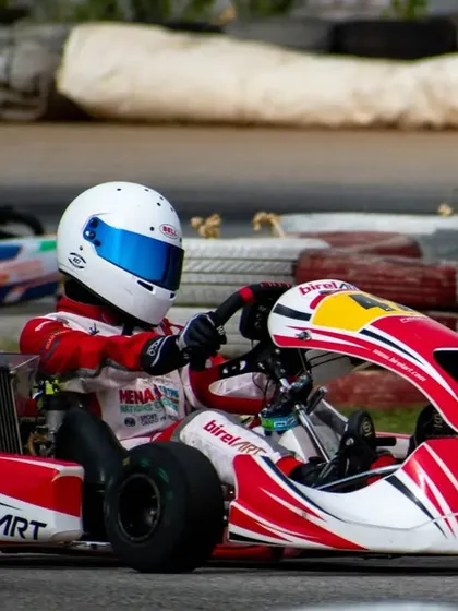 Our driver in kart number 42, seen here taking a wide line to prepare for a corner, a key technique for maintaining momentum.