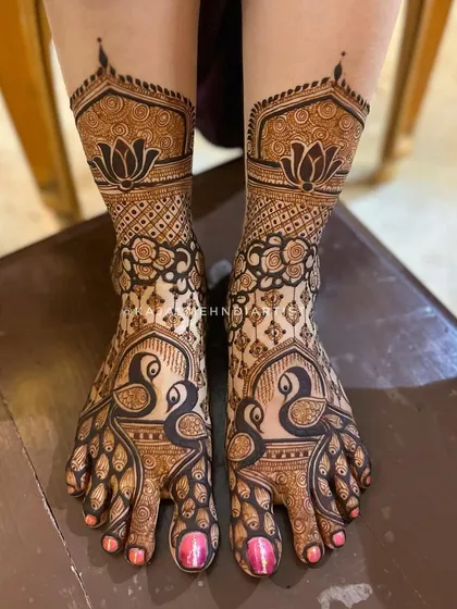 A classic bridal foot design with large, graceful peacocks as the centerpiece, complemented by lotus flowers at the ankle.