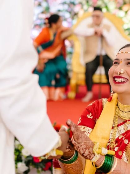 A bride's joyful, upward glance at her groom during their wedding ceremony. This candid shot captures the love and excitement of the moment perfectly.