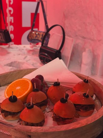 Mini BBQ Chicken Sliders served under the dramatic red lighting of the Diesel brand event. These savory bites were a huge hit, offering a smoky and satisfying flavour.