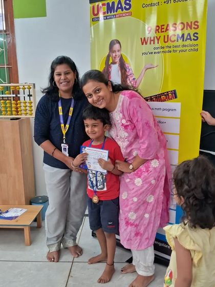 A happy student receives his certificate, marking a successful step in his learning journey.